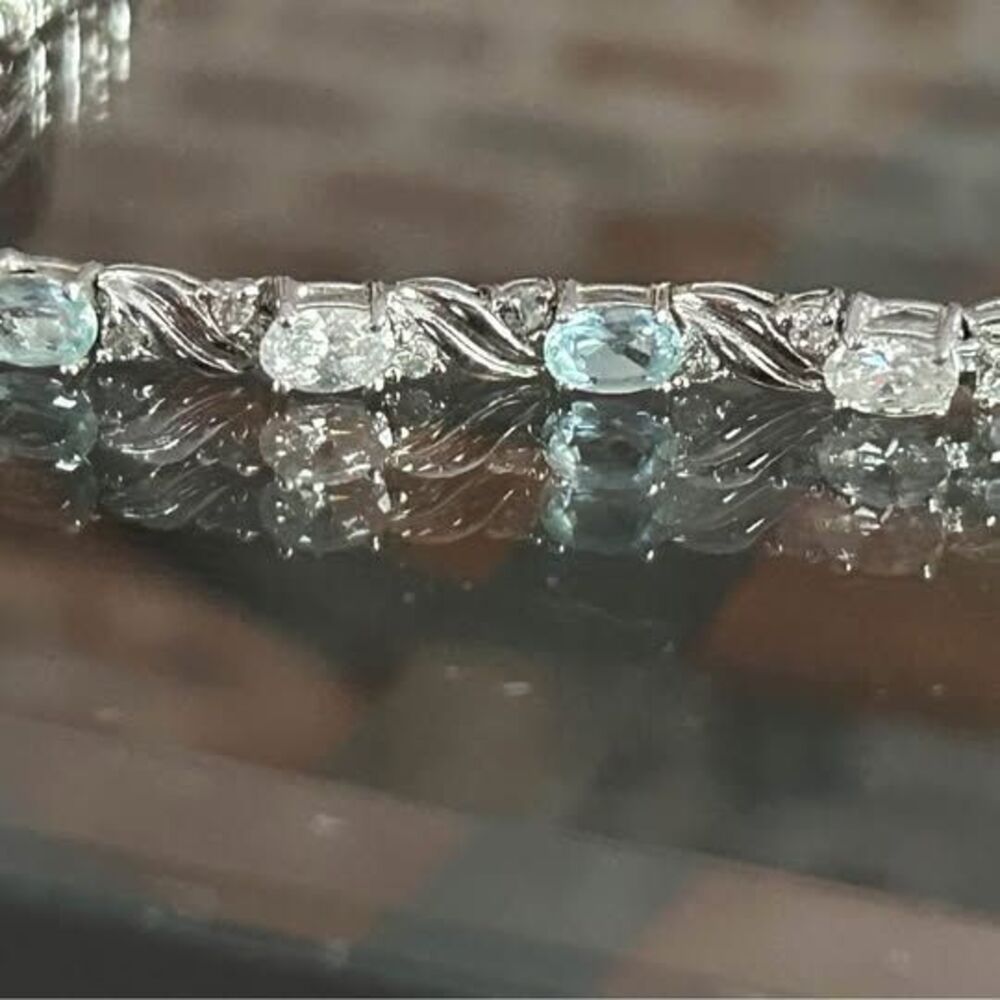 Silver toned blue and white stone bracelet.
